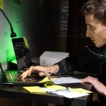 Top ethical hacking tools including Kali Linux, Nmap, Wireshark, Metasploit, and Burp Suite displayed on a cybersecurity analyst workstation